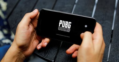 A boy plays Tencent Holdings' PUBG videogame on his mobile phone at a cafe in New Delhi, India, Sept. 3, 2020. (Reuters Photo)