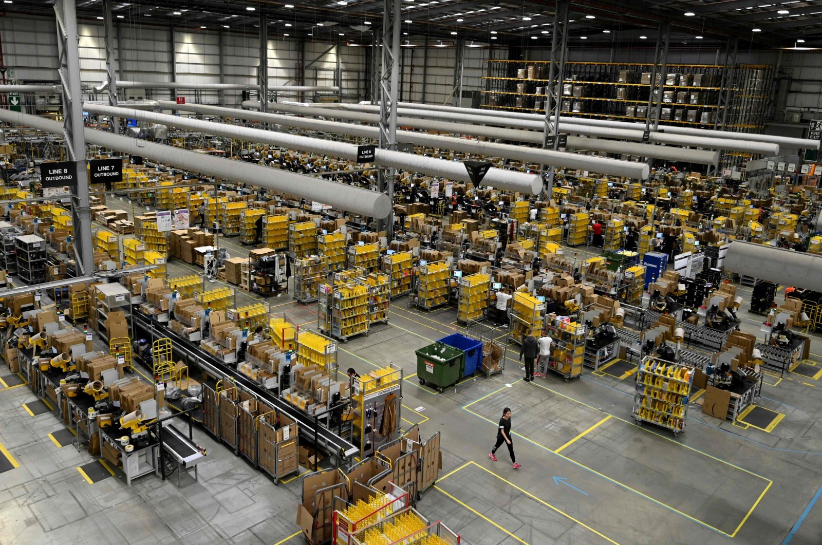 Amazon workers sort and pack items at the Amazon Fulfilment Centre in Peterborough, east England, Nov. 27, 2019. (AFP Photo)