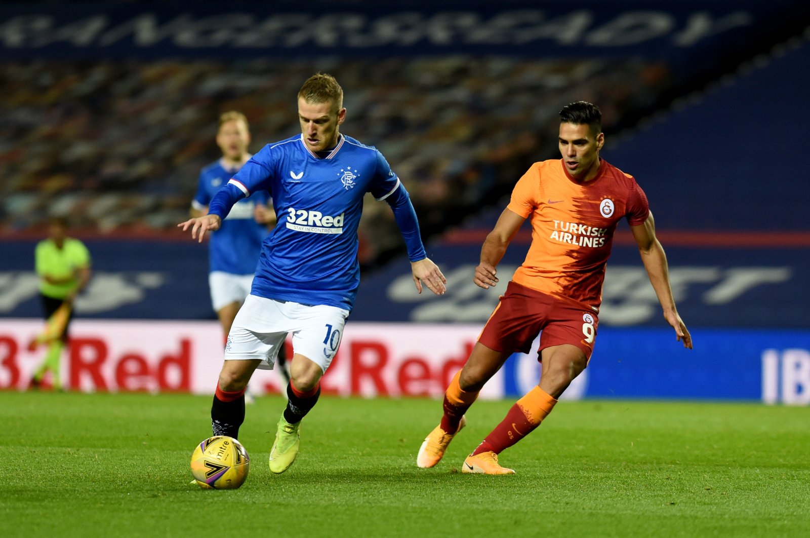 Rangers' Steven Davies (L) and Galatasaray's Radamel Falcao compete for the ball during the Europa League playoff match in Glasgow, Scotland, Oct. 1, 2020. (AA Photo)