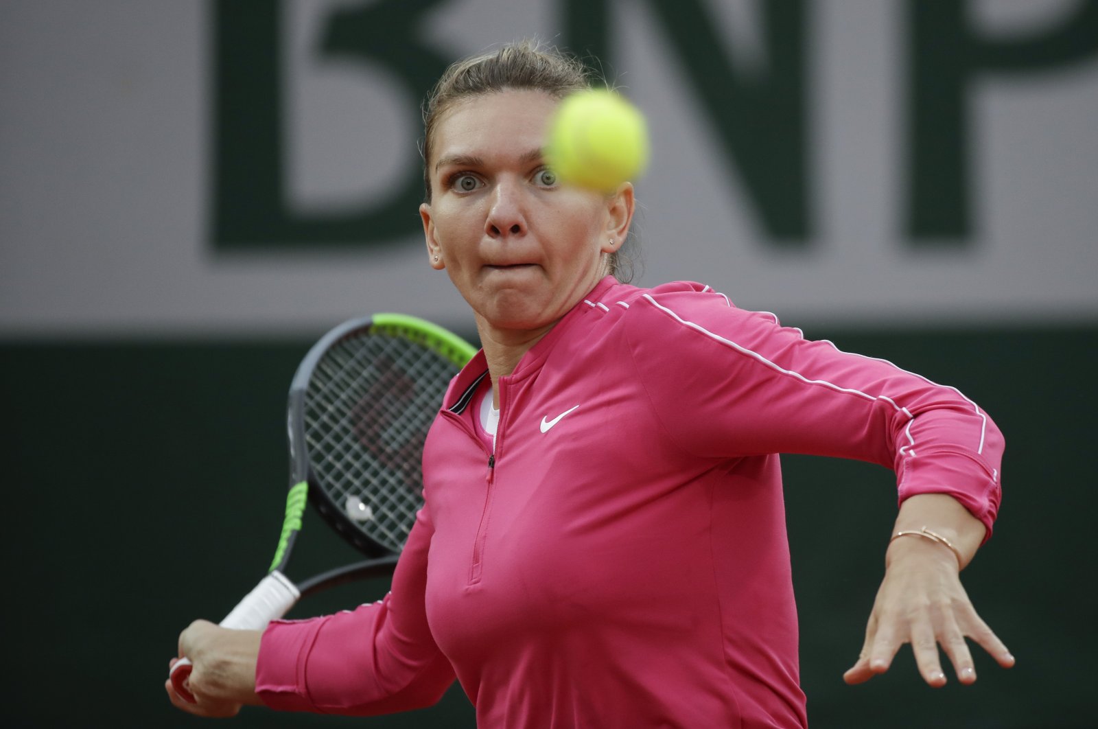 Simona Halep plays a shot against Irina-Camelia Begu during a French Open tennis match, in Paris, France, Sept. 30, 2020. (AP Photo)