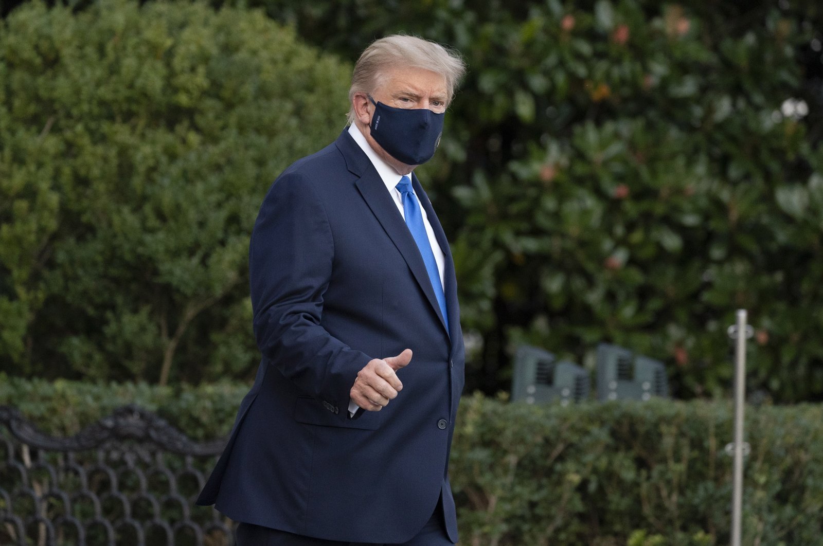President Donald Trump gives a thumbs-up as he leaves the White House to go to Walter Reed National Military Medical Center after he tested positive for COVID-19 in Washington D.C., Oct. 2, 2020. (AP Photo)