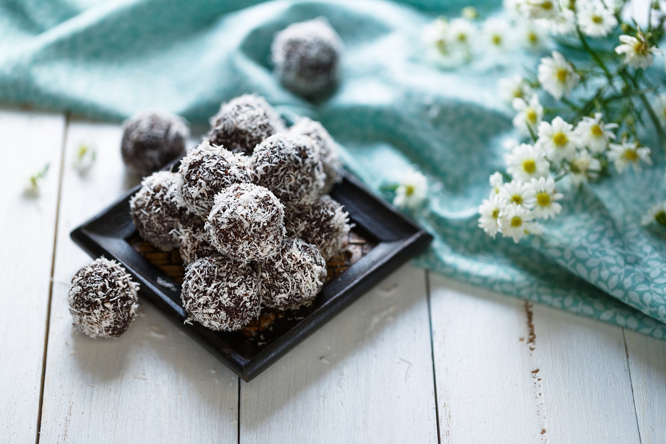 Covering the date balls in shredded coconut not only adds flavor but also visual appeal. (iStock Photo)
