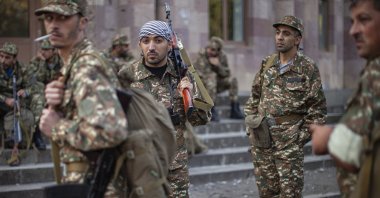 Volunteer Armenian recruits gather at a center where they receive their uniforms and weapons before being dispatched to the frontline near Nagorno-Karabakh, Azerbaijan, Sept. 29, 2020. (AP Photo)