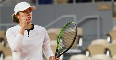 Iga Swiatek celebrates after winning a point against Simona Halep during the French Open tennis tournament, in Paris, France, Oct. 4, 2020. (AFP Photo)