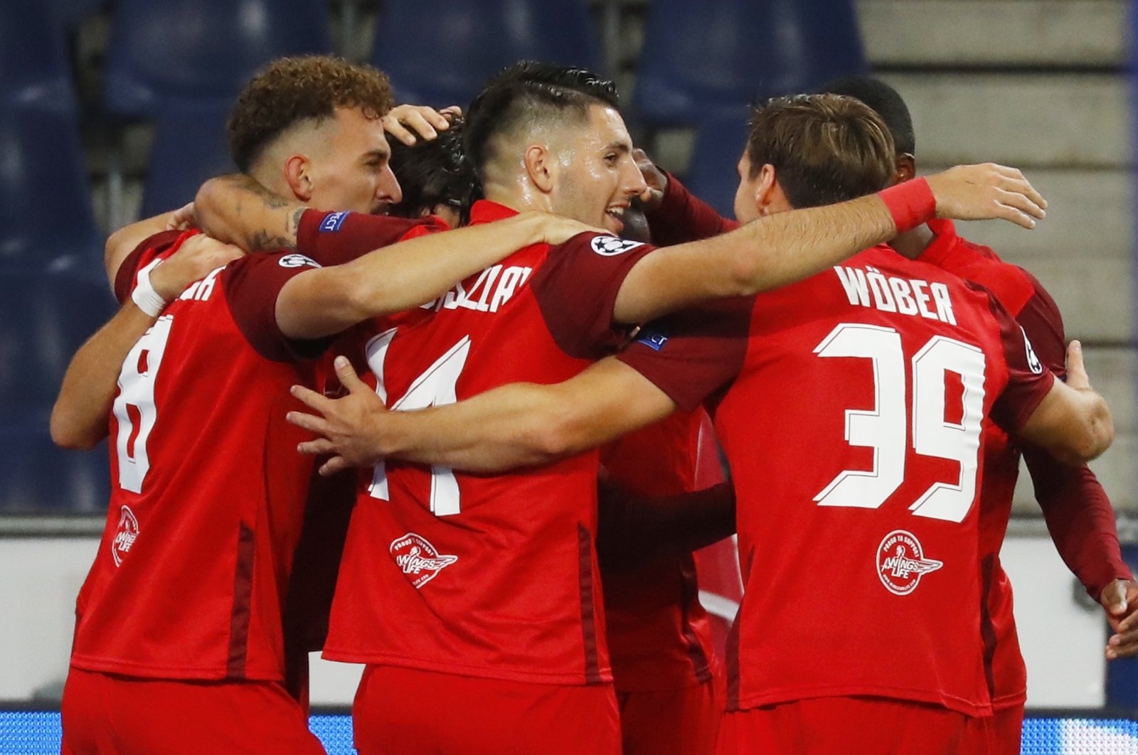 Salzburg players celebrate a goal during the Champions League playoff match against Maccabi Tel Aviv, in Salzburg, Austria, Sept. 30, 2020. (Reuters Photo)
