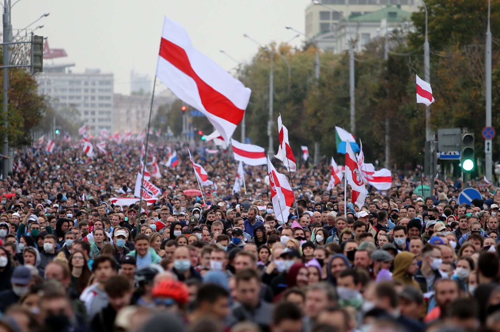 Opposition supporters parade through the streets during a rally to protest the country's presidential inauguration in Minsk, Belarus, Sept. 27, 2020. (AFP Photo)