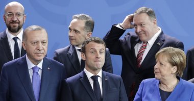  In this Sunday, Jan. 19, 2020 file photo, German Chancellor Angela Merkel, front right, speaks with French President Emmanuel Macron, front center, and Turkish President Recep Tayyip Erdoğan during a group photo at a conference on Libya at the chancellery in Berlin, Germany. (AP Photo)