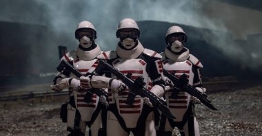 The Commonwealth soldiers arrive the meeting of Eugene Porter with a survivor in "The Walking Dead" season finale.