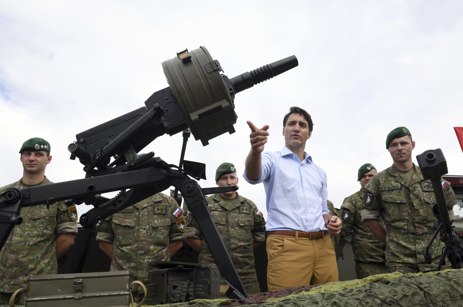 Canadian Prime Minister Justin Trudeau gestures while inspecting the troops as he visits Adazi Military Base in Kadaga, Latvia, July 10, 2018. (AP Photo)