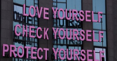 A message for breast cancer awareness decorates a building during a campaign for Breast Cancer Awareness Month, in Beirut, Lebanon, Oct. 11, 2018. (AP Photo)
