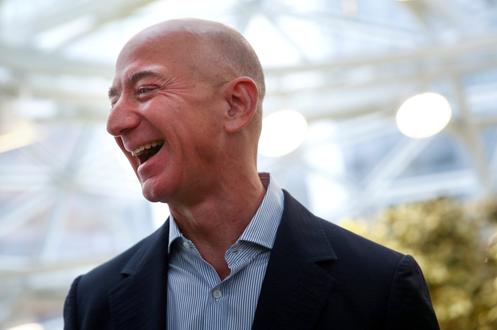 Amazon founder and CEO Jeff Bezos laughs as he talks to the media while touring the new Amazon Spheres during the grand opening at Amazon's headquarters in Seattle, Washington, U.S., Jan. 29, 2018. (Reuters Photo)
