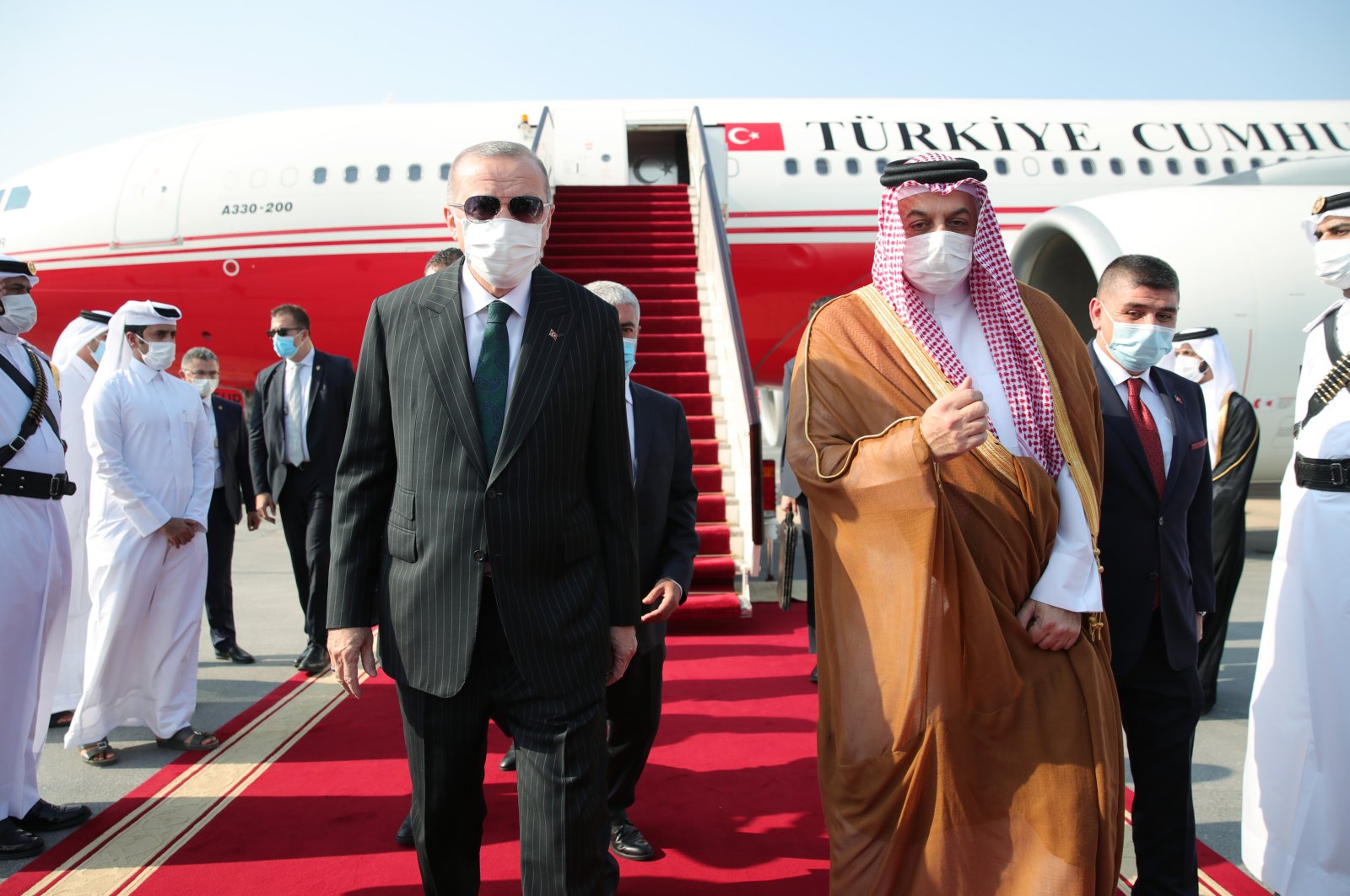 President Recep Tayyip Erdoğan is welcomed by a Qatari delegation headed by Defense Minister Khalid bin Mohammad Al Attiyah during a visit to Doha, Qatar, Oct. 7, 2020. (AA Photo)