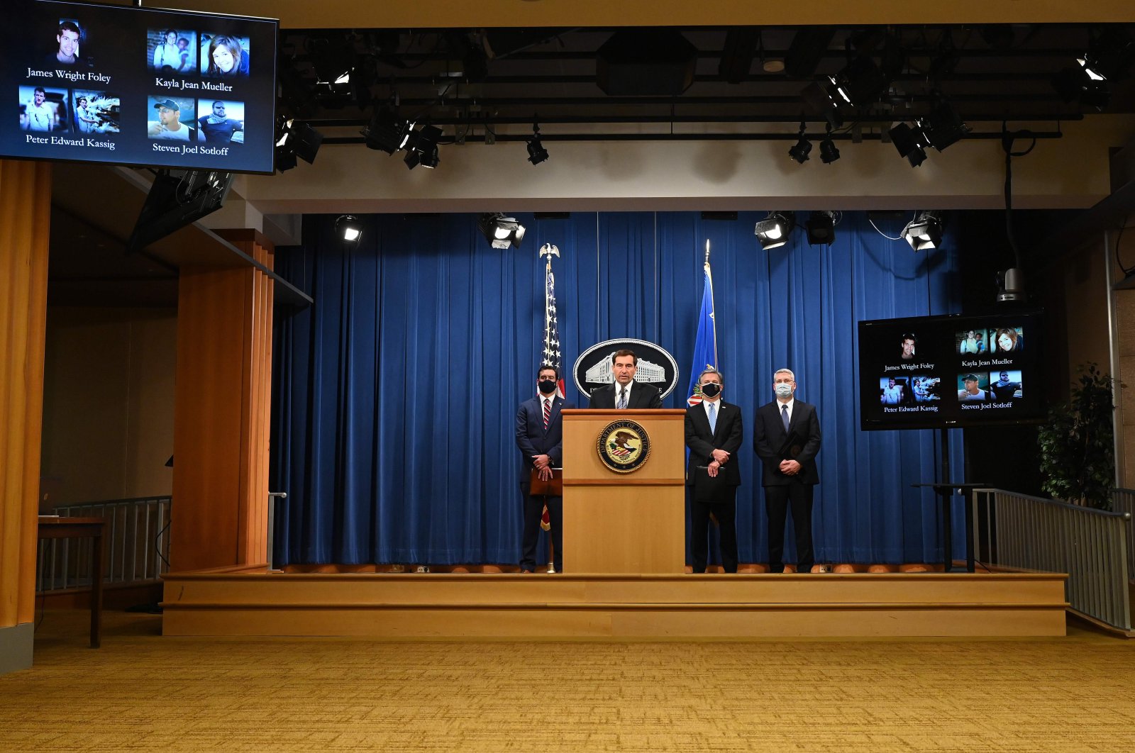 Assistant Attorney General John C. Demers (C) of the National Security Division, FBI Director Christopher Wray (2nd R), U.S. Attorney for the Eastern District of Virginia G. Zachary Terwilliger (L) and Acting Assistant Director in Charge of the FBI Washington Field Office James A. Dawson (R) host a news conference on a national security matter at the Department of Justice, Washington, D.C., U.S., Oct. 7, 2020. (AFP Photo)