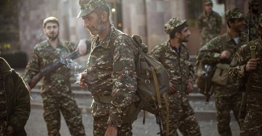 Armenian volunteer recruits gather at a center to receive their uniforms and weapons before being dispatched to the frontline near Nagorno-Karabakh, Azerbaijan, Sept. 29, 2020. (AP Photo)