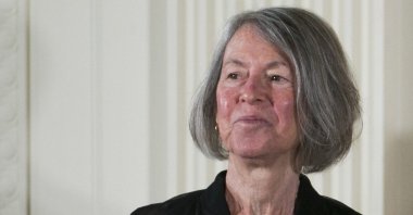 U.S. poet Louise Gluck with the 2015 National Humanities Medal during a ceremony in the East Room of the White House in Washington, D.C., Sept. 22, 2016. (EPA Photo)
