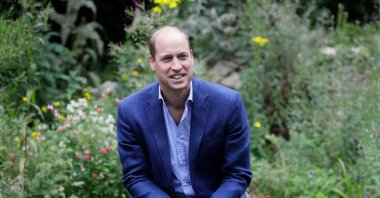 Prince William, Duke of Cambridge, speaks with visitors at the Garden House of the Light Project in Peterborough, England, June 16, 2020. (AFP Photo)