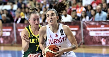 Olcay Çakır of Turkey (R) grabs the ball in a match against Lithuania in the 2021 qualifiers, in Mersin, southern Turkey, Nov. 17, 2019. (AA Photo) 
