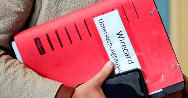 A person carries documents for a session of the investigative committee on the Wirecard accounting scandal, in Berlin, Germany, Oct. 8, 2020. (Reuters Photo)