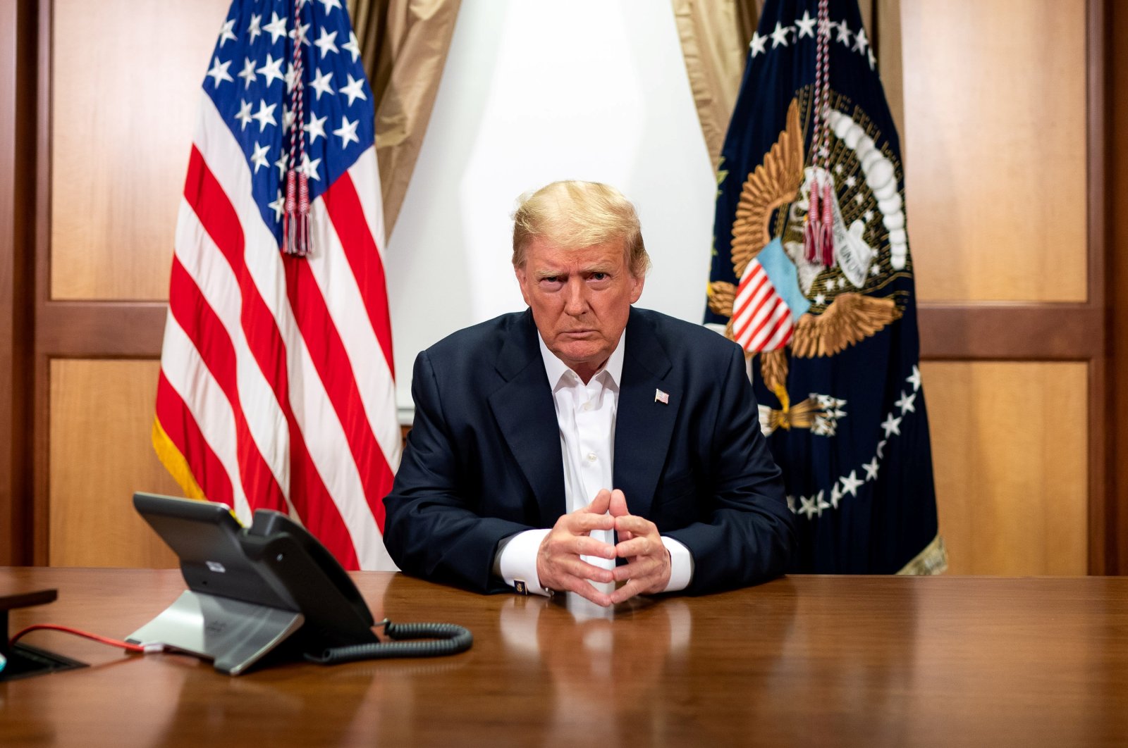 U.S. President Donald Trump participates in a phone call with Vice President Mike Pence, Secretary of State Mike Pompeo, and Chairman of the Joint Chiefs of Staff Gen. Mark Milley on Oct. 4, 2020. (Reuters Photo)