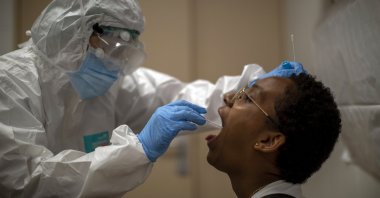 A health worker takes a sample for a PCR test for the COVID-19 at a local hospital in Hospitalet, in Barcelona province, Spain, July 14, 2020. (AP Photo)