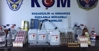 Police forces display seized ingredients and equipment to produce bootleg alcohol, in Antalya, Turkey, Oct. 8, 2020. (AA Photo) 