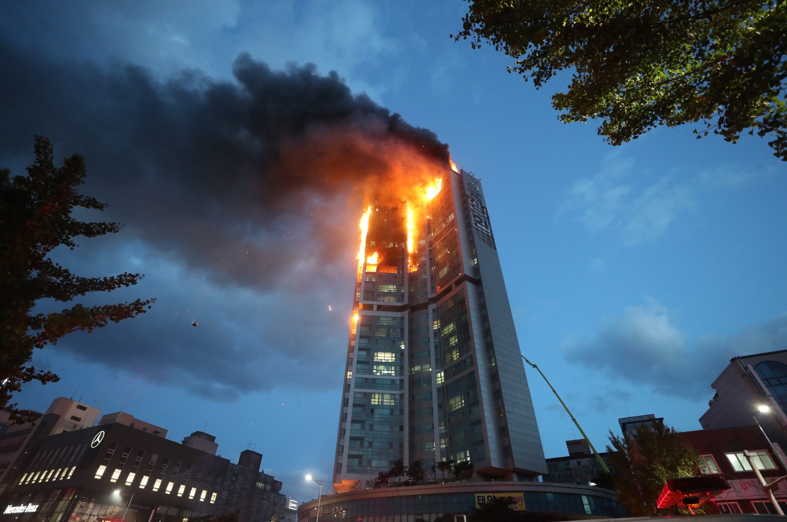 An apartment building is engulfed in a fire in Ulsan, South Korea, Oct. 9, 2020. (Yonhap via AP)