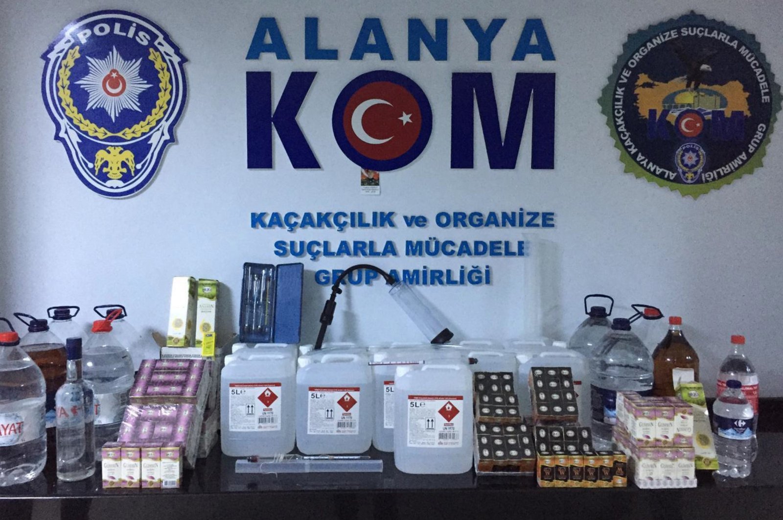 Police forces display seized ingredients and equipment to produce bootleg alcohol, in Antalya, Turkey, Oct. 8, 2020. (AA Photo) 