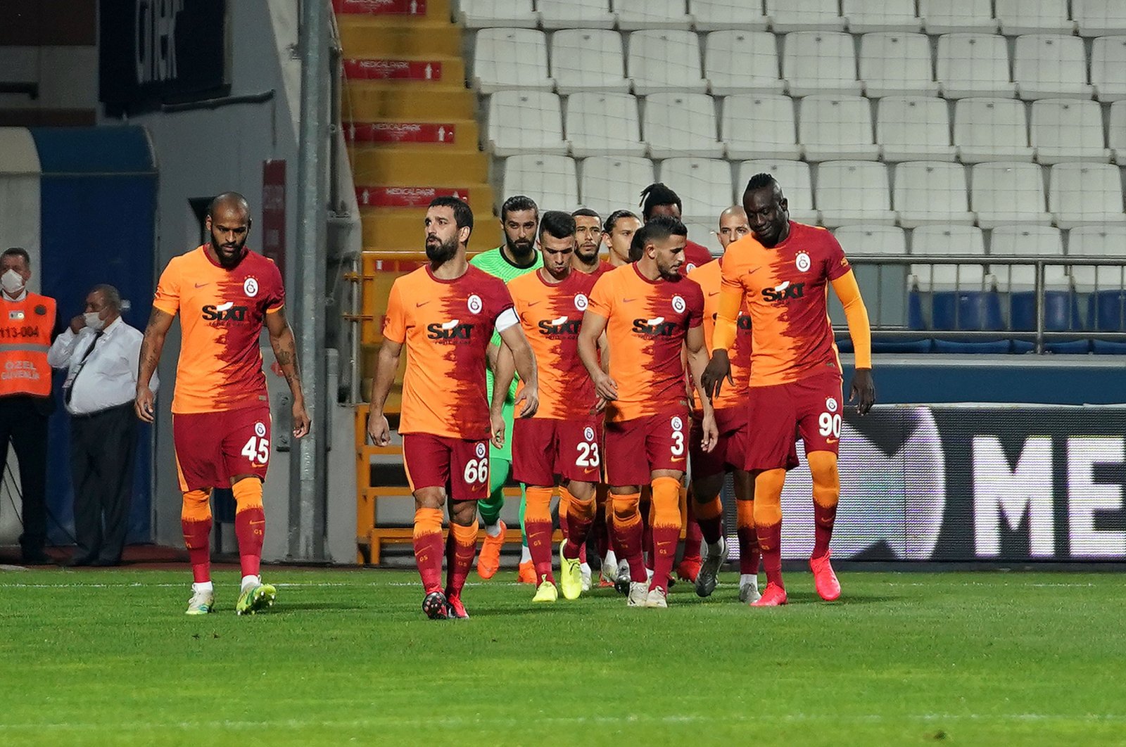 Galatasaray players walk on the pitch during a Süper Lig match against Kasımpaşa, in Istanbul, Turkey, Oct. 4, 2020. (IHA Photo)
