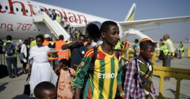Newly-arrived Jewish immigrants coming from Ethiopia step off the plane upon their arrival at Ben Gurion International Airport on Aug. 28, 2013 near the Israeli costal city of Tel Aviv. (AFP Photo)
