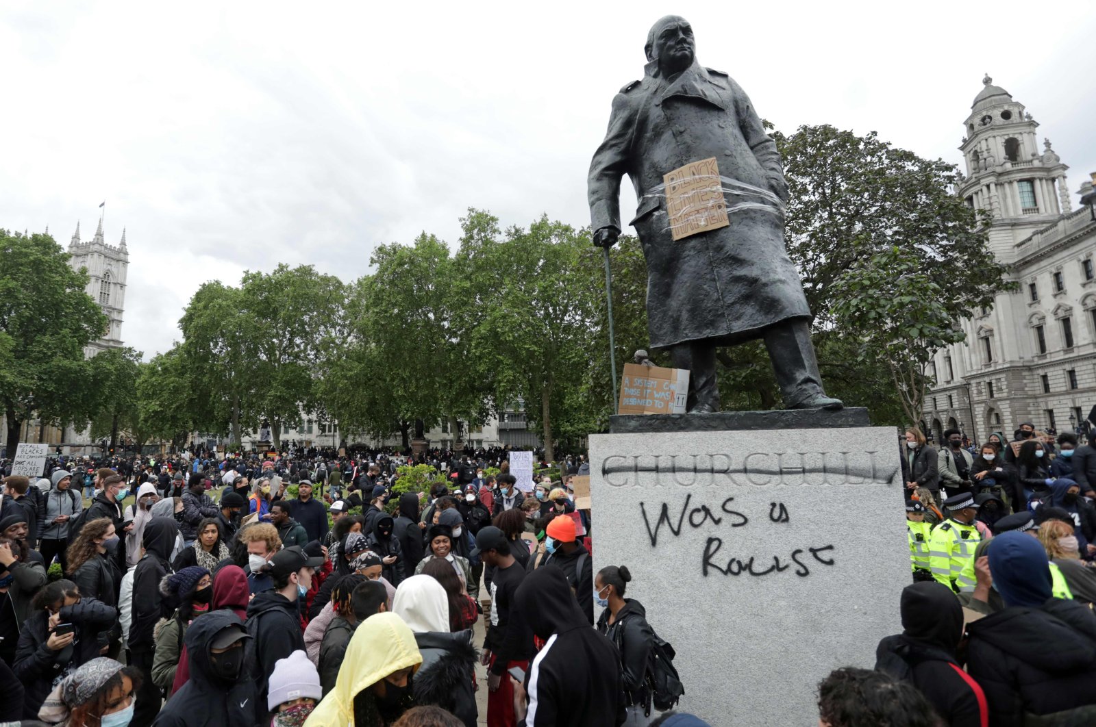The statue of former British prime minister Winston Churchill is seen defaced, with the words (Churchill) "was a racist" written on it's base in Parliament Square, central London after a demonstration outside the US Embassy, on June 7, 2020. (AFP Photo)