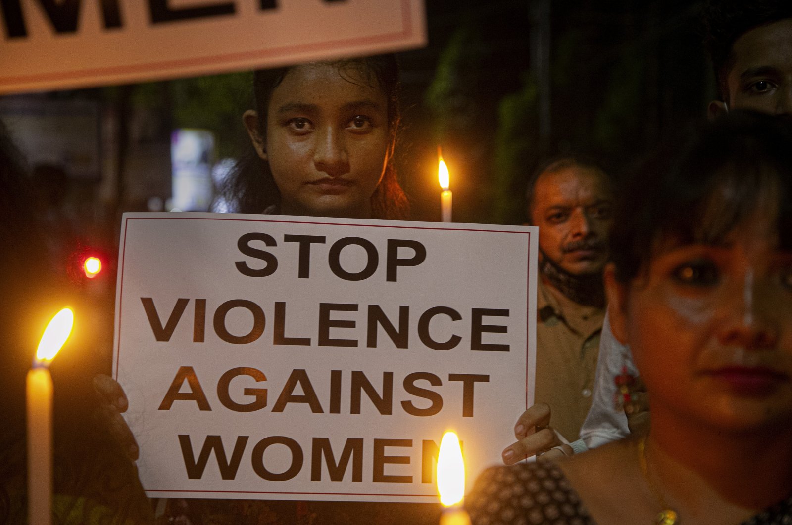 Indian women hold placards protesting against the alleged gang rape and killing of a Dalit woman in Uttar Pradesh state, in Gauhati, India, Saturday, Oct. 10, 2020.  (AP Photo)