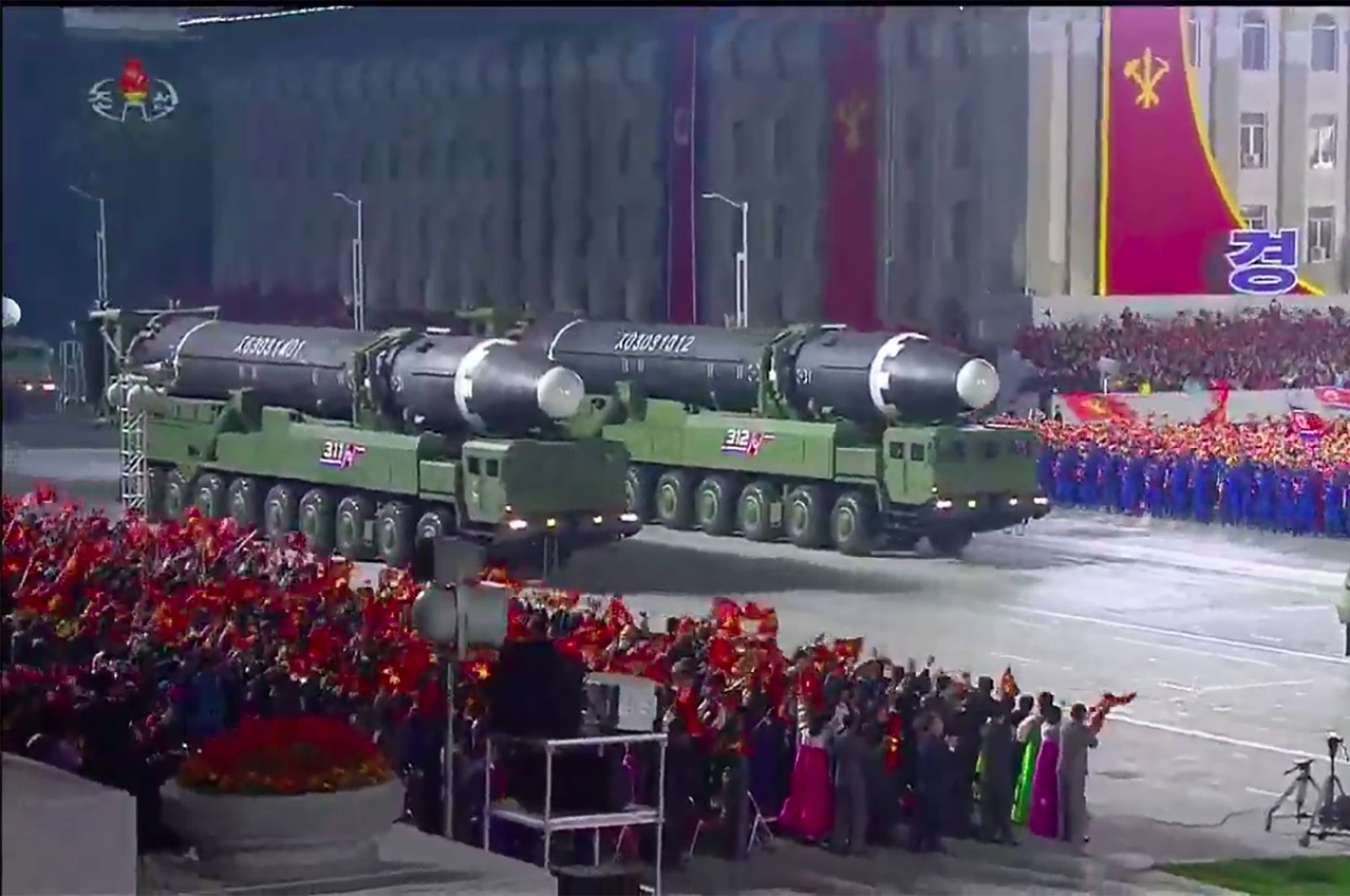 A screen grab taken from a KCNA broadcast shows what appears to be new North Korean intercontinental ballistic missiles during a military parade marking the 75th anniversary of the founding of the Workers' Party of Korea, on Kim Il Sung square in Pyongyang, Oct. 10, 2020 (Photo by - / KCNA VIA KNS / AFP)