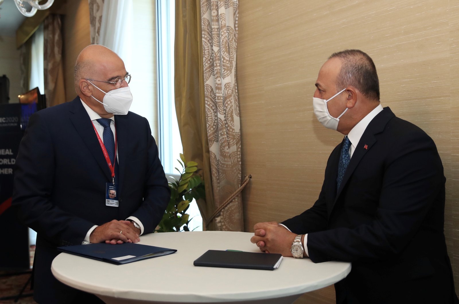 Foreign Minister Mevlüt Çavuşoğlu speaks with his Greek counterpart Nikos Dendias on the sidelines of the Global Security Forum in Bratislava, Slovakia, Oct. 8, 2020. (Turkish Foreign Ministry handout)