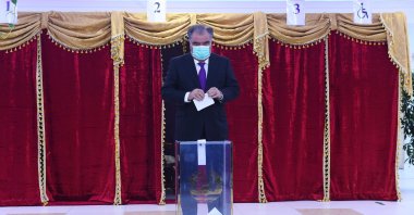 Tajikistan's President and Presidential candidate Emomali Rakhmon casts his ballot at a polling station during the presidential election in Dushanbe, Tajikistan, Oct. 11, 2020. (Press service of the President of Tajikistan/Reuters)
