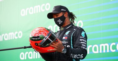 Lewis Hamilton holds the helmet of Michael Schumacher that was gifted to him, after winning the German F1 Grand Prix, in Nurburg, Germany, Oct. 11, 2020. (AFP Photo)