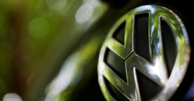 A logo of German carmaker Volkswagen is seen on a car parked on a street in Paris, France, July 9, 2020. (Reuters Photo)