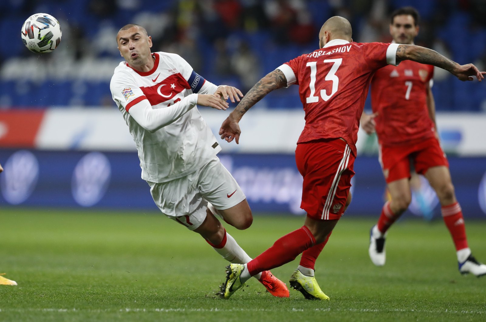 Turkey's Burak Yımaz (L) and Russia's Fyodor Kudryashov battle for the ball during a UEFA Nations League match in Moscow, Russia, Oct. 11, 2020. (AP Photo)