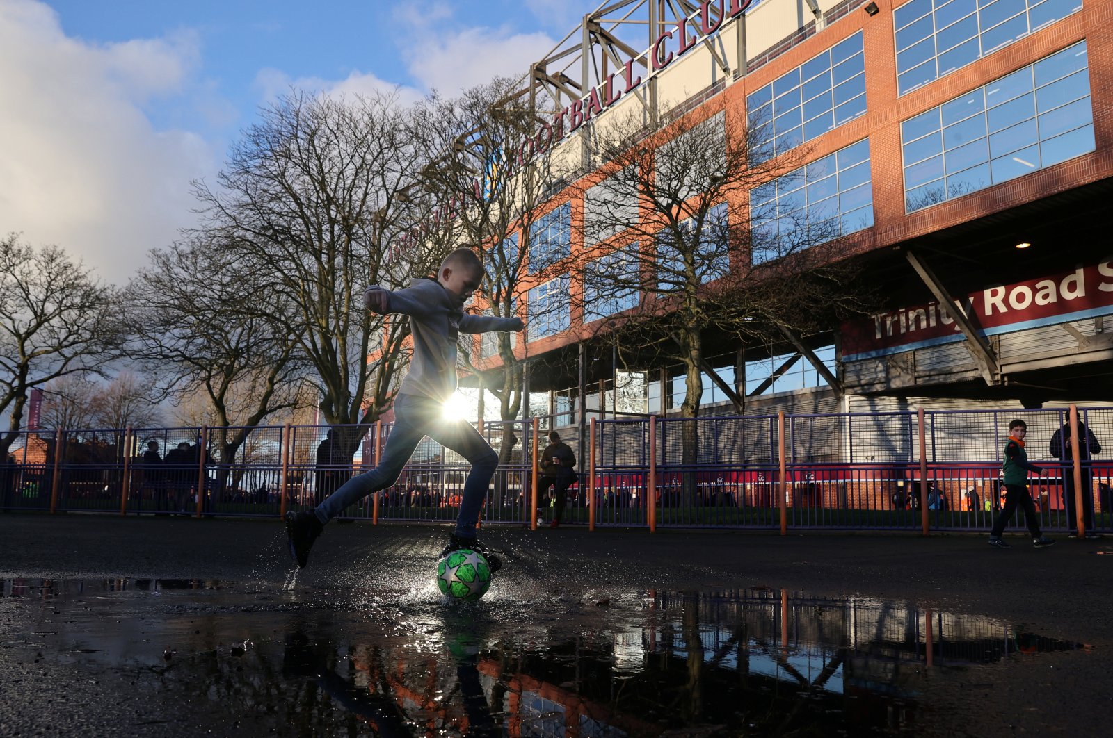 General view of a child playing football outside the stadium before the match, Villa Park, Birmingham, Britain on Jan. 12, 2020. (Reuters Photo)