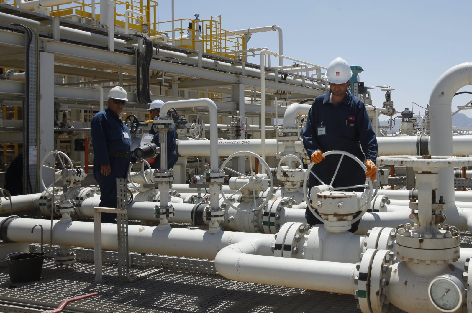 Employees work at the Tawke oil field in the Kurdistan Regional Government (KRG) of northern Iraq, May 31, 2009. (AP Photo)