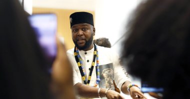 Congolese activist Mwazulu Diyabanza talk to the media at the Palais de Justice courthouse, in Paris, Sept. 30, 2020. (AP Photo)