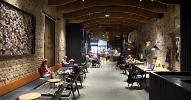People enjoy coffee and space in one of the Espressolab stores in Istanbul, Oct. 14, 2020. (AA Photo)
