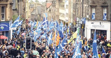 U.K. pro-independence activists wave Scottish saltire flags as they march from Holyrood to the Meadows, Edinburgh, Scottland, Oct. 5, 2019. (AFP)