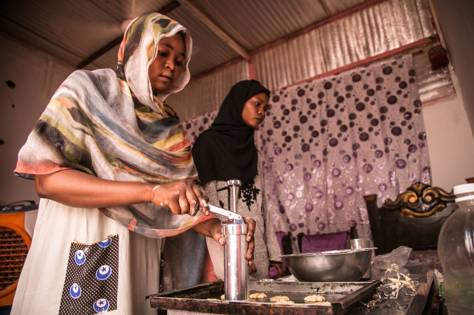 Two Sudanese women prepare pastries to sell in capital Khartoum, Sudan, Oct. 14, 2020. (AA Photo)