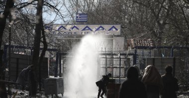 Greek security forces use tear gas against migrants at the Turkish-Greek border in Pazarkule, Edirne region, Turkey, March 11, 2020. (AP Photo)