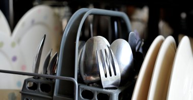 Dirty crockery and eating utensils wait to be washed in a dishwasher. (Reuters File Photo)