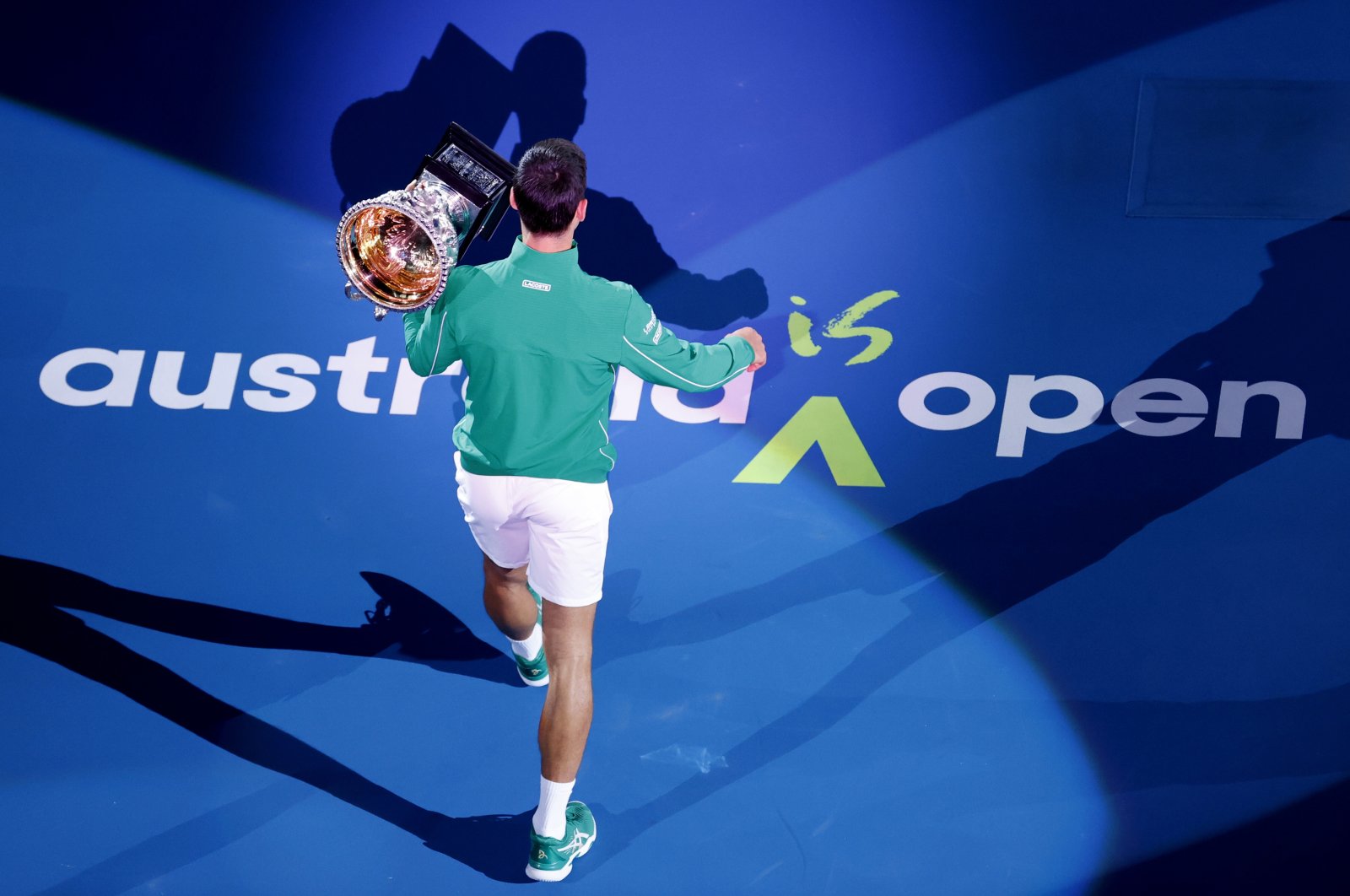 Novak Djokovic holds his trophy after winning the Australian Open tennis tournament, in Melbourne, Australia, Feb. 3, 2020. (AP Photo)