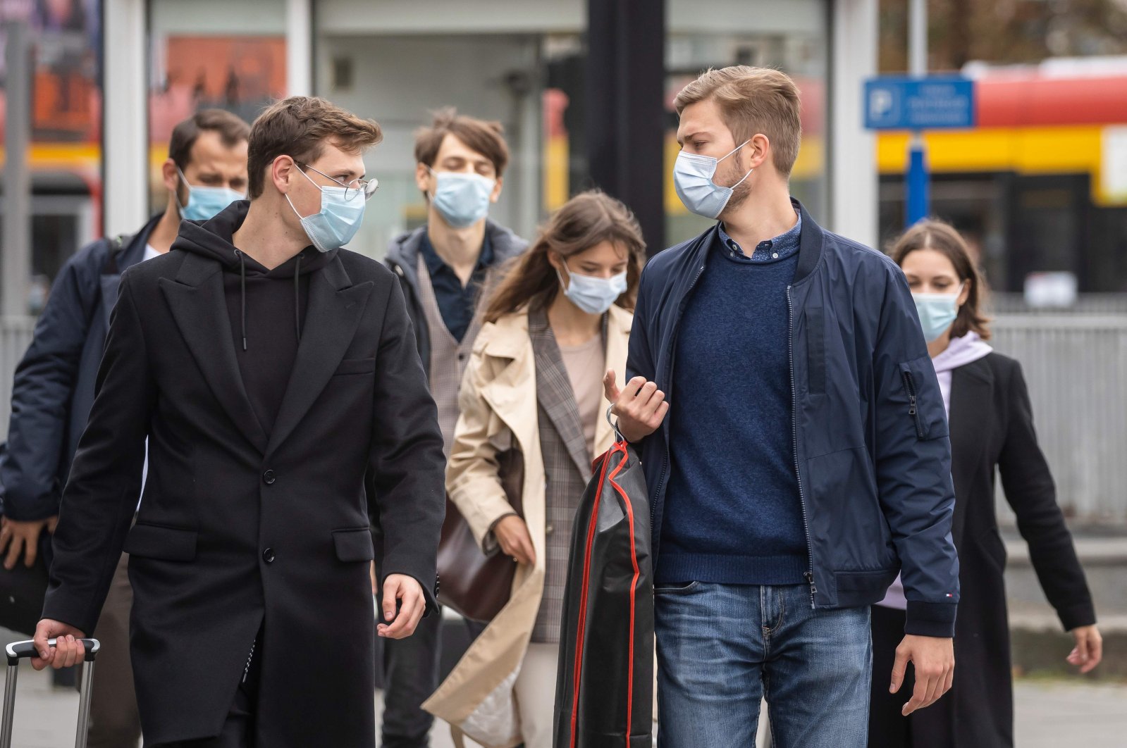 People wearing protective masks are seen on the streets of Warsaw after the Polish government tightened restrictions in the fight against the coronavirus and introduced mandatory mouth and nose coverage in public places, Oct. 10, 2020. (AFP Photo)