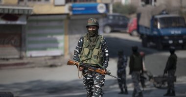 An Indian paramilitary soldier patrols during a gunfight between government forces and suspected rebels, Srinagar, Oct. 12, 2020. (AP Photo)