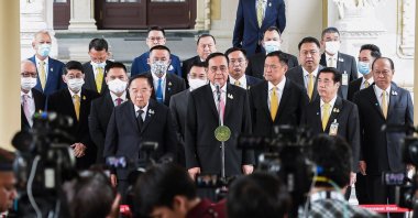 Thailand's Prime Minister Prayut Chan-O-Cha speaking at a press conference at the Government House in Bangkok while cabinet ministers look on following a cabinet meeting on Oct. 16, 2020. (Royal Thai government Photo via AFP)