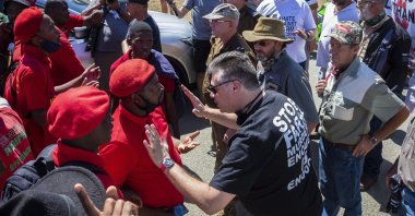 Economic Freedom Fighters (EFF) supporters standoff with farmers supporting United Against Farm Murders AfriForum during the bail application for two men accused of murdering young farm manager Brendin Horner, Senekal, South Africa, 16 October 2020. (EPA Photo)